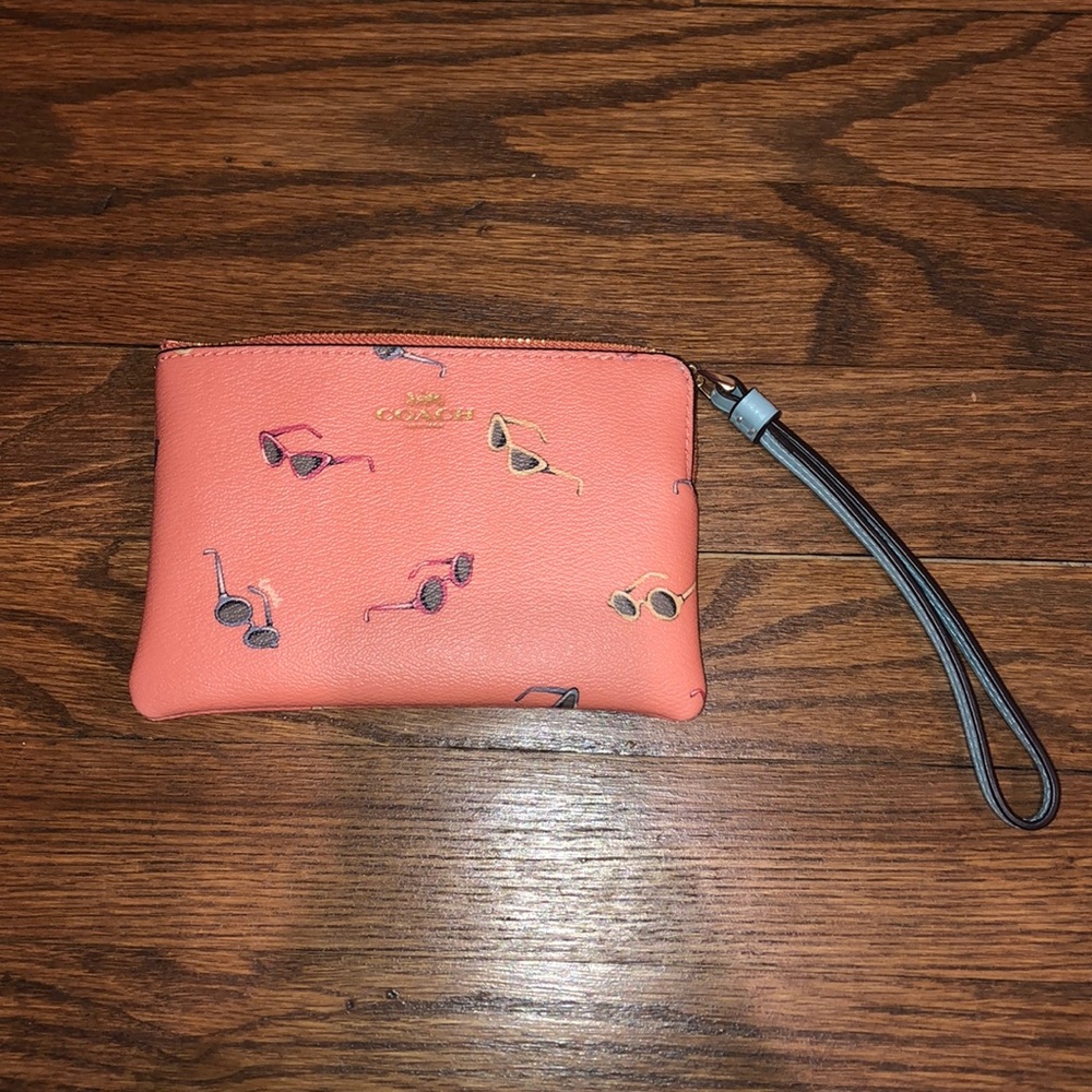 Coral Coach Wristlet with sunglasses